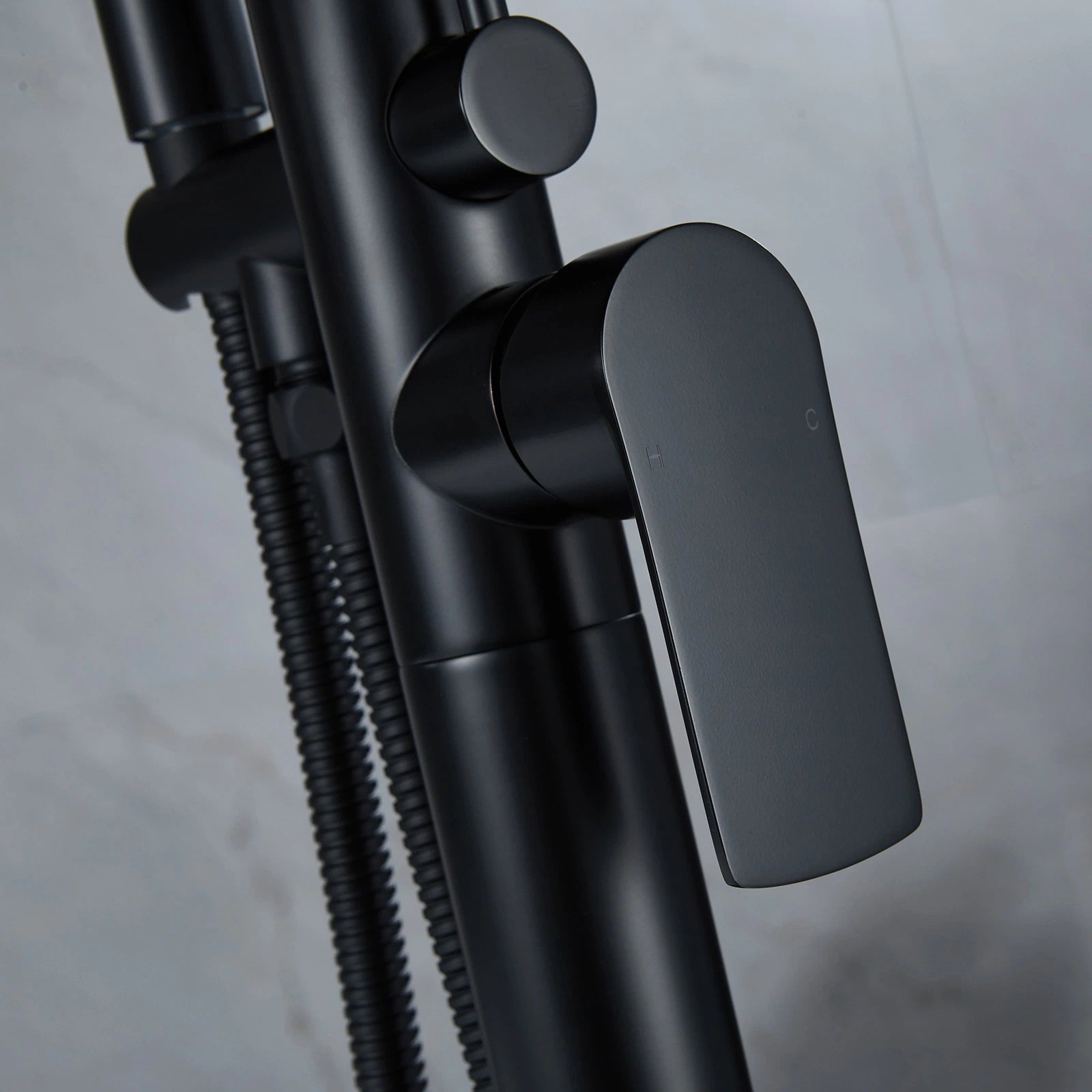 Single-Handle Freestanding Floor Mount Roman Tub Faucet Bathtub Filler with Hand Shower in Matte Black - Designery